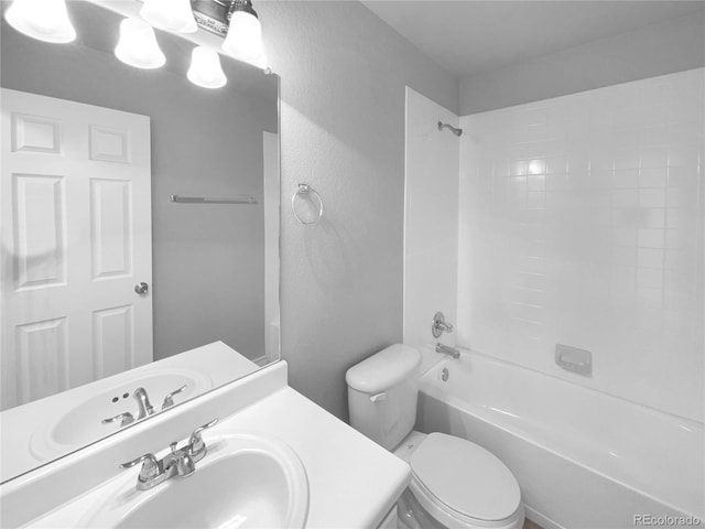 full bathroom featuring shower / bathing tub combination, vanity, and toilet