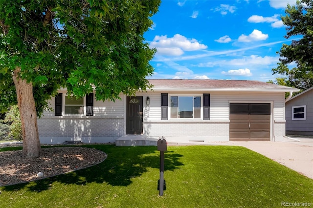 5554 Crystal Way, Denver, CO 80239 - ranch-style home featuring brick siding, driveway, a front lawn, and a garage
