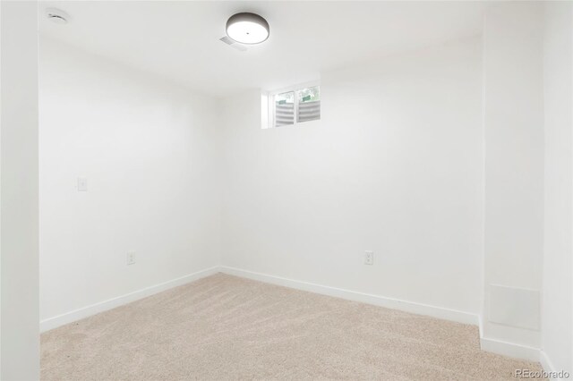 5554 Crystal Way, Denver, CO 80239 - spare room with light carpet and a smoke detector