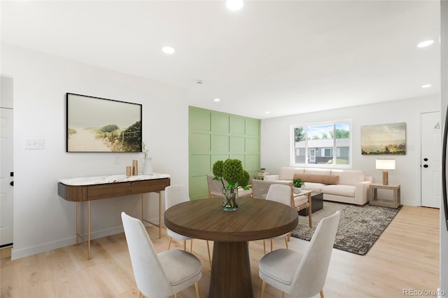 5554 Crystal Way, Denver, CO 80239 - dining area with light wood-style flooring and recessed lighting