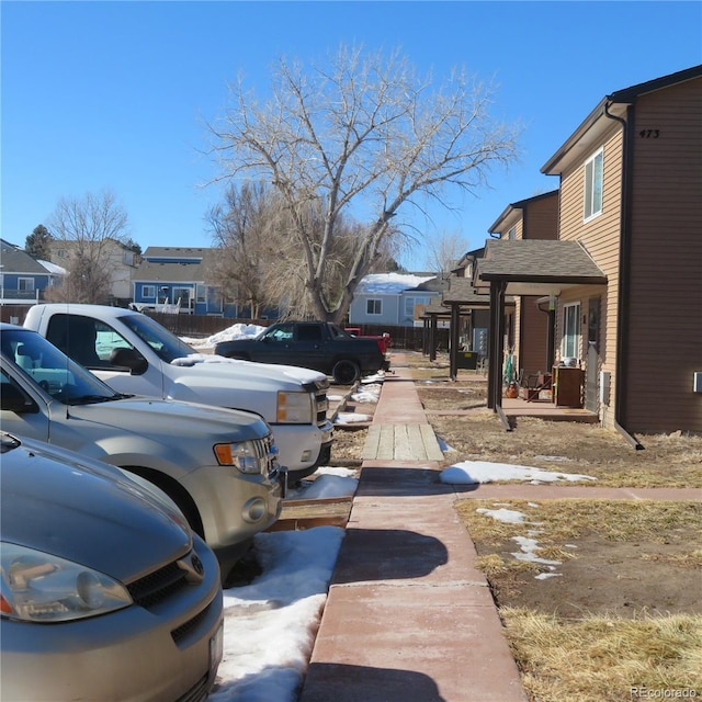 view of parking with a residential view