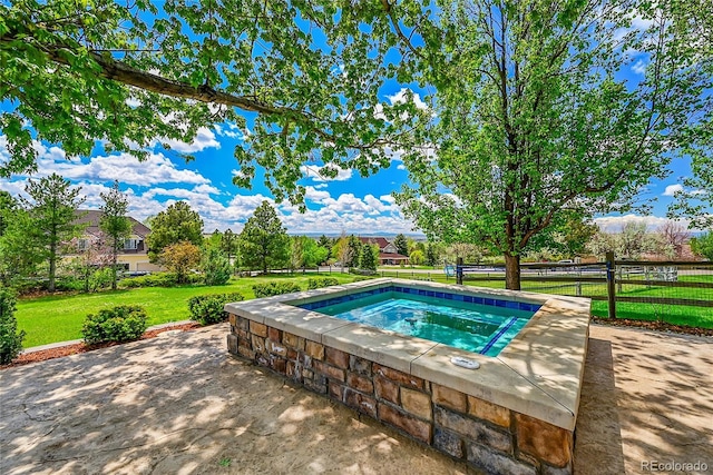 view of pool featuring an in-ground hot tub and a patio