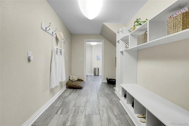 mudroom featuring baseboards