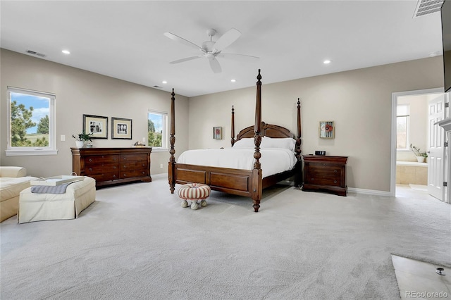 bedroom with light colored carpet, baseboards, recessed lighting, a ceiling fan, and ensuite bathroom
