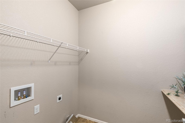 laundry room with washer hookup, baseboards, electric dryer hookup, and laundry area