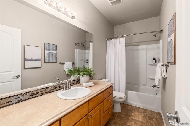 bathroom with shower / bath combo with shower curtain, vanity, and toilet