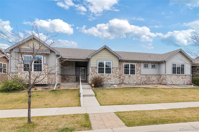 single story home with a front lawn, stone siding, and a shingled roof