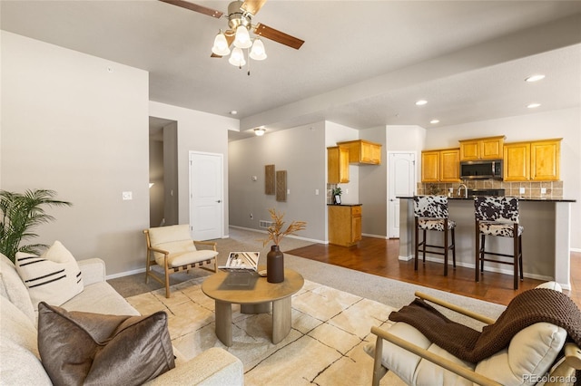 2975 Denver Dr, Fort Collins, CO 80525 - living area featuring ceiling fan, recessed lighting, baseboards, and light carpet