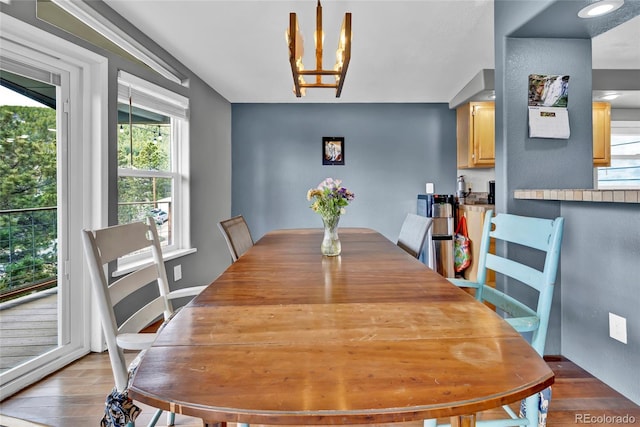 248 Copperdale Ln, Golden, CO 80403 - dining space with an inviting chandelier and light wood finished floors