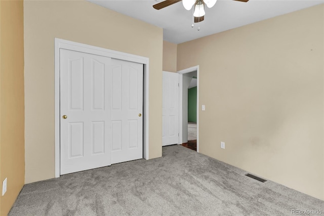 248 Copperdale Ln, Golden, CO 80403 - unfurnished bedroom featuring a closet, carpet, ceiling fan, and visible vents