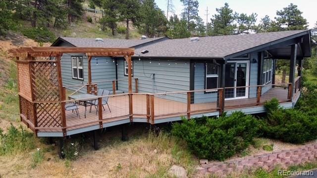248 Copperdale Ln, Golden, CO 80403 - rear view of house featuring a deck and roof with shingles