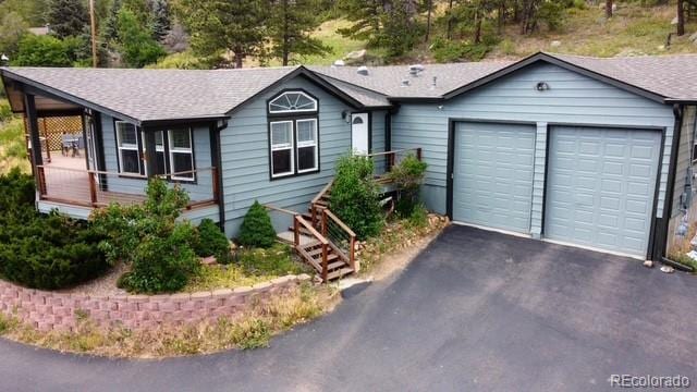 248 Copperdale Ln, Golden, CO 80403 - single story home with driveway, a garage, and a shingled roof