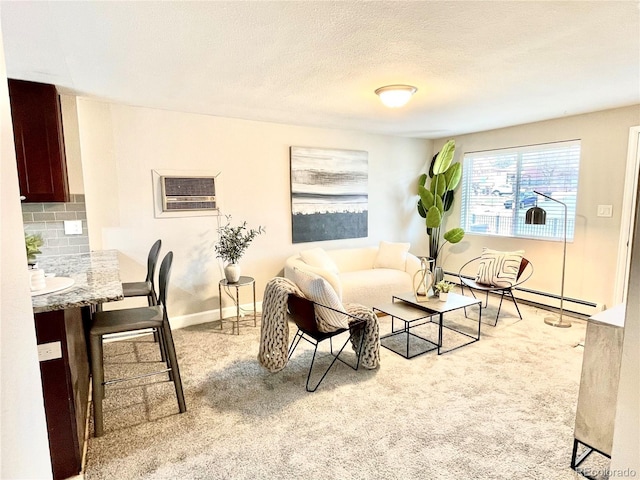 carpeted living room featuring a textured ceiling, a baseboard heating unit, and baseboards