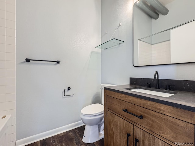2501 15th St Unit 3D, Denver, CO 80211 - bathroom with vanity, wood finished floors, toilet, and baseboards