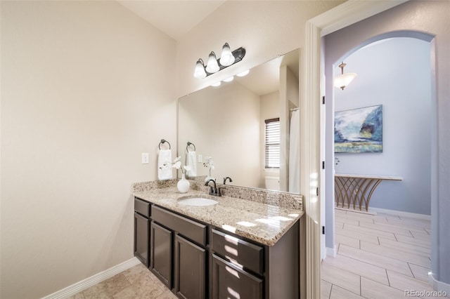 bathroom with vanity and toilet