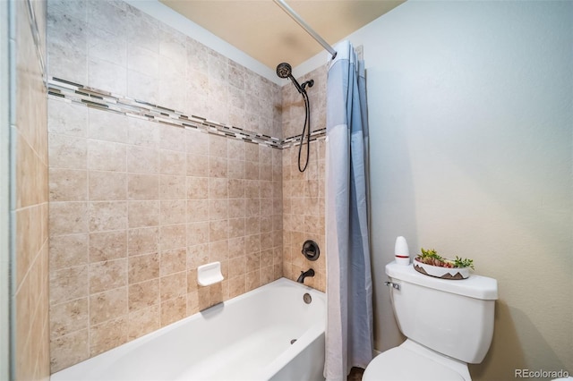 bathroom featuring shower / bath combination with curtain and toilet