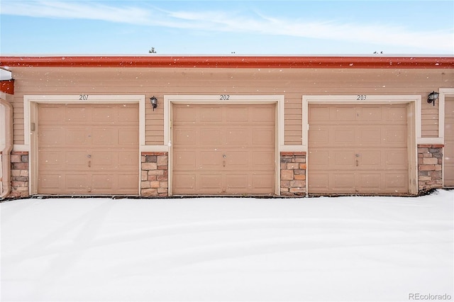 view of snow covered garage