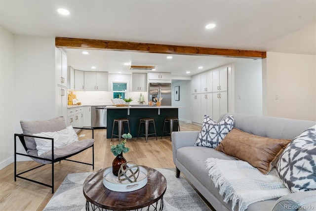 1815 Ingalls St, Lakewood, CO 80214 - living area featuring beamed ceiling, light wood-style floors, recessed lighting, and baseboards