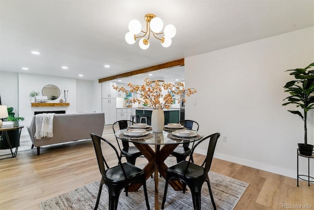 1815 Ingalls St, Lakewood, CO 80214 - dining area featuring light wood-style floors, recessed lighting, a chandelier, and baseboards