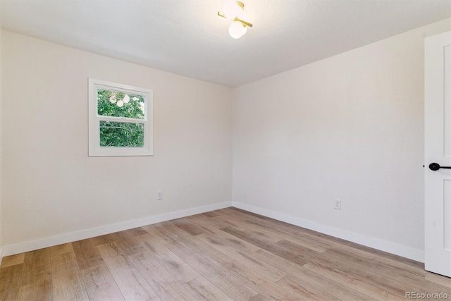 1815 Ingalls St, Lakewood, CO 80214 - spare room featuring light wood-type flooring and baseboards