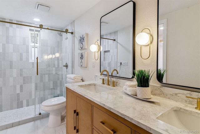 1815 Ingalls St, Lakewood, CO 80214 - full bath featuring double vanity, a shower stall, toilet, and a textured wall