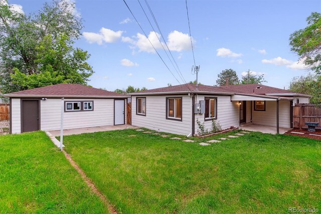 1815 Ingalls St, Lakewood, CO 80214 - back of property featuring a patio area and an outdoor structure