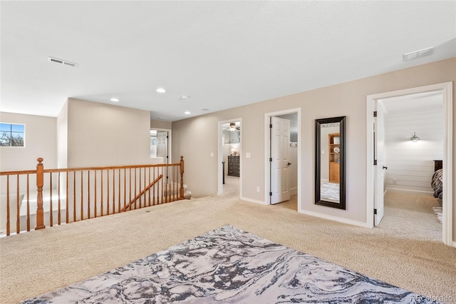 interior space with baseboards, carpet, visible vents, and recessed lighting