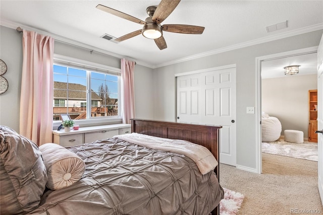 bedroom with light colored carpet, visible vents, crown molding, and baseboards