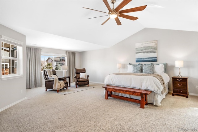 carpeted bedroom with a ceiling fan, lofted ceiling, and baseboards