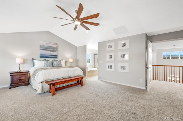 bedroom with baseboards, a ceiling fan, lofted ceiling, ensuite bath, and carpet floors