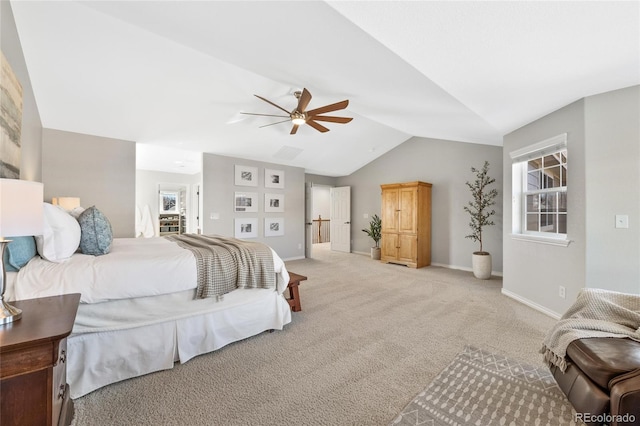 bedroom featuring light carpet, vaulted ceiling, a ceiling fan, and baseboards