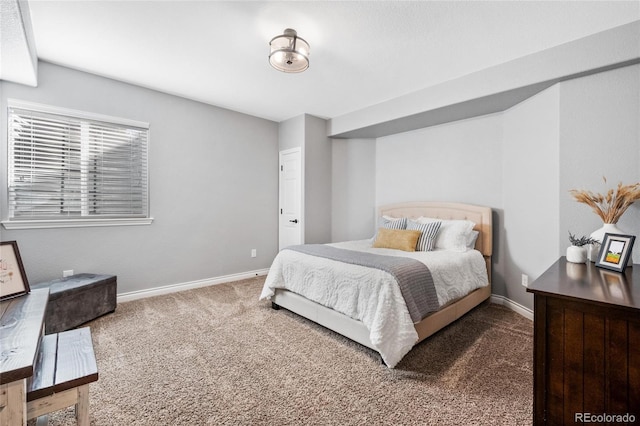 carpeted bedroom with baseboards