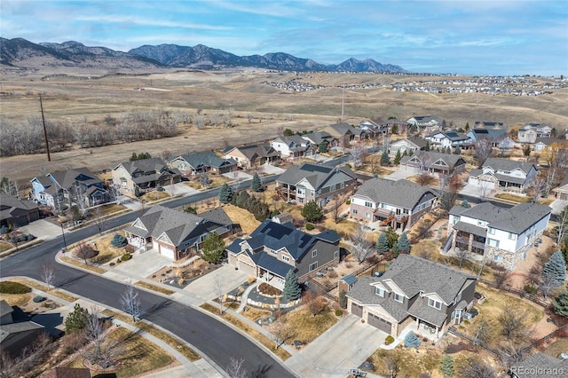 birds eye view of property with a residential view and a mountain view