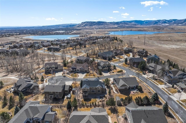 bird's eye view featuring a residential view and a water and mountain view