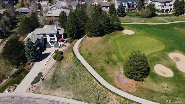 birds eye view of property featuring a residential view and view of golf course