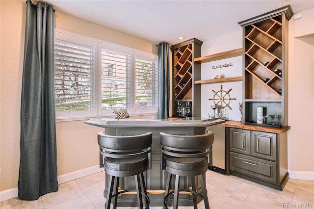 6961 Salvia St, Arvada, CO 80007 - indoor bar with light tile patterned floors