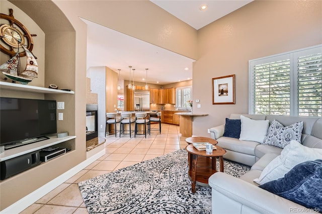 6961 Salvia St, Arvada, CO 80007 - living room featuring light tile patterned floors and recessed lighting