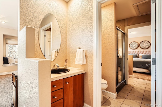 6961 Salvia St, Arvada, CO 80007 - full bath featuring connected bathroom, a stall shower, vanity, tile patterned flooring, and a textured wall