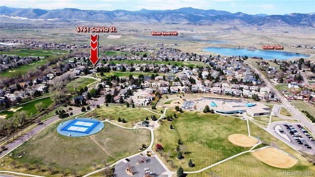 6961 Salvia St, Arvada, CO 80007 - aerial view of property's location with a water and mountain view and nearby suburban area