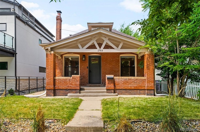 1753 W 36th Ave, Denver, CO 80211 - view of front of house featuring brick siding and covered porch