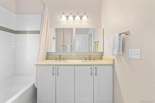 1753 W 36th Ave, Denver, CO 80211 - bathroom featuring shower / bathtub combination with curtain and double vanity