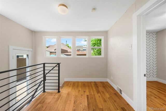 1753 W 36th Ave, Denver, CO 80211 - unfurnished room featuring light wood-style flooring and a smoke detector