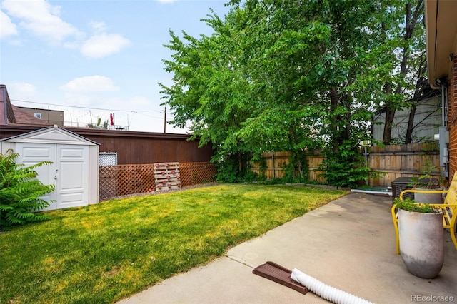1753 W 36th Ave, Denver, CO 80211 - fenced backyard featuring a storage unit and a patio area