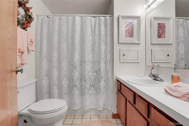 4863 Silver Spruce Ln, Evergreen, CO 80439 - bathroom featuring vanity, toilet, tile patterned floors, and a shower with shower curtain