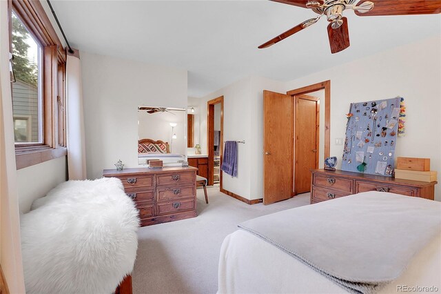 4863 Silver Spruce Ln, Evergreen, CO 80439 - bedroom with light colored carpet, a ceiling fan, and ensuite bathroom