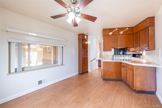 kitchen featuring light hardwood / wood-style flooring and ceiling fan