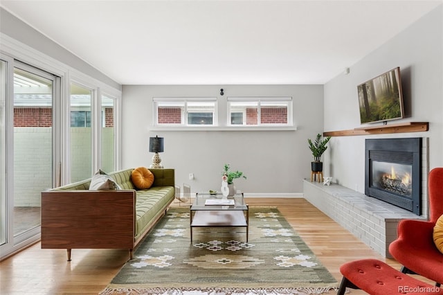 260 S Jasmine St, Denver, CO 80224 - living area with wood finished floors, plenty of natural light, and a fireplace