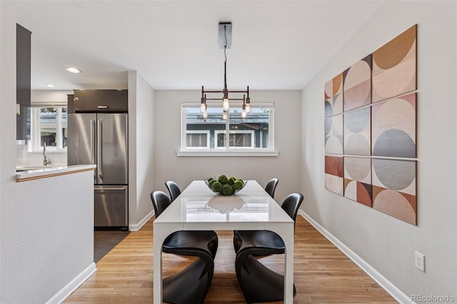 260 S Jasmine St, Denver, CO 80224 - dining area with light wood-style flooring, baseboards, a chandelier, and recessed lighting