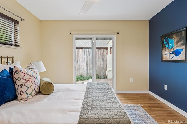 260 S Jasmine St, Denver, CO 80224 - bedroom featuring wood finished floors, access to exterior, baseboards, and a ceiling fan