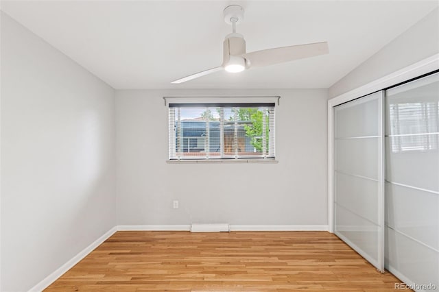 260 S Jasmine St, Denver, CO 80224 - unfurnished bedroom with light wood-type flooring, baseboards, a closet, and a ceiling fan
